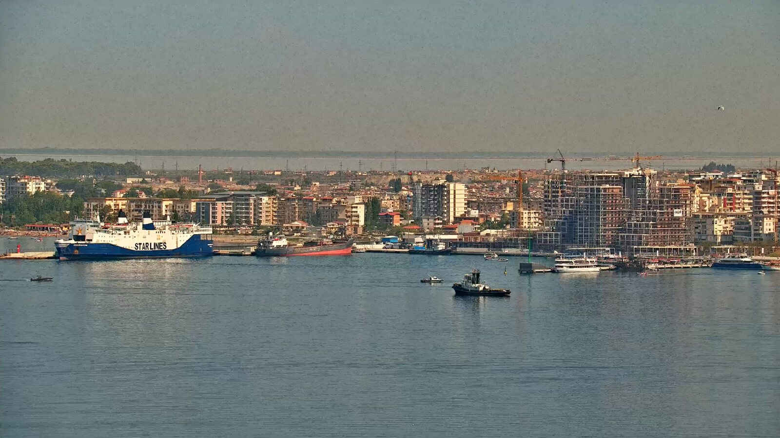 Ferry, boats and port activity in Vlora Bay